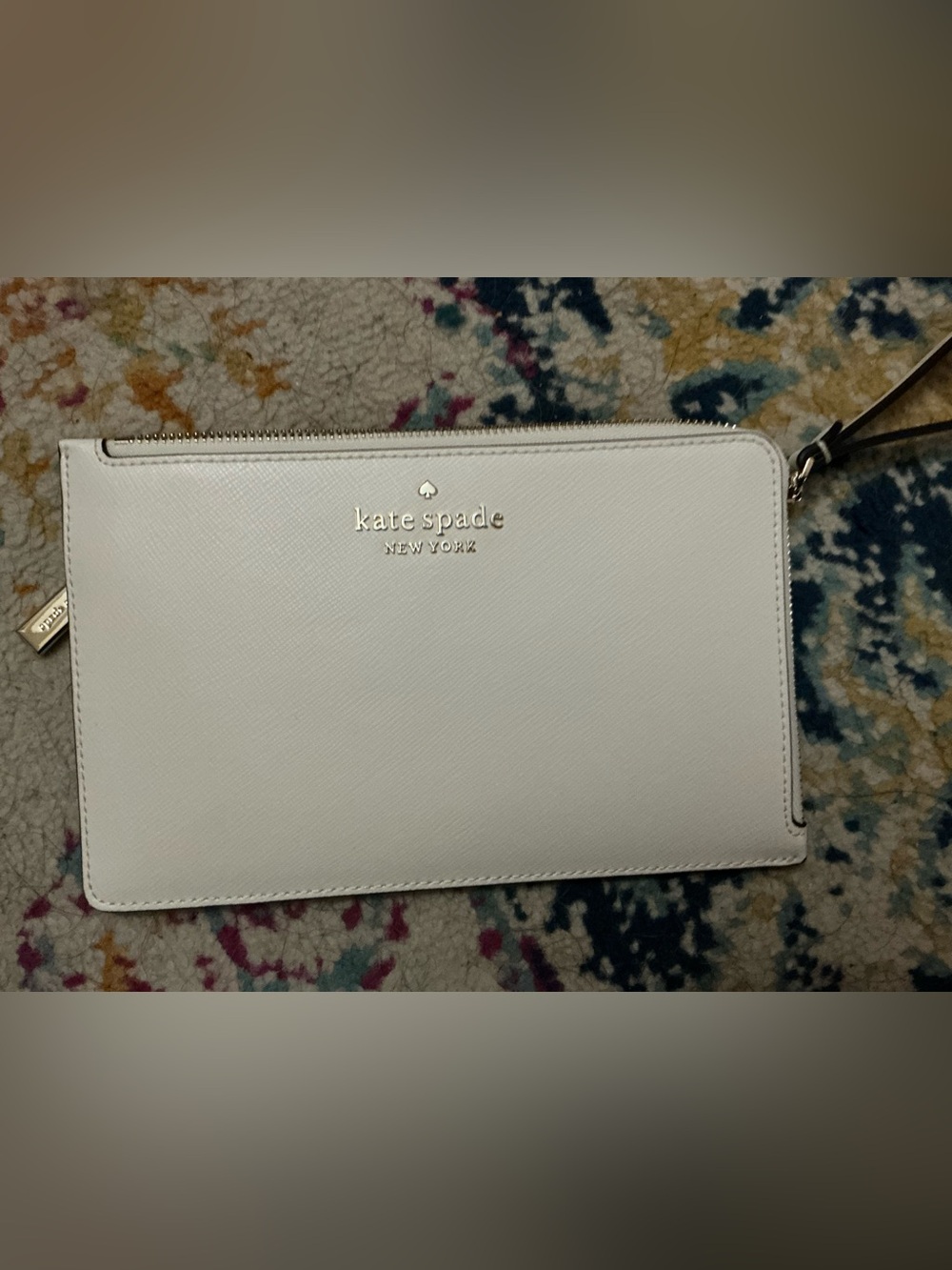 kate spade white zip wristlet clutch with gold logo